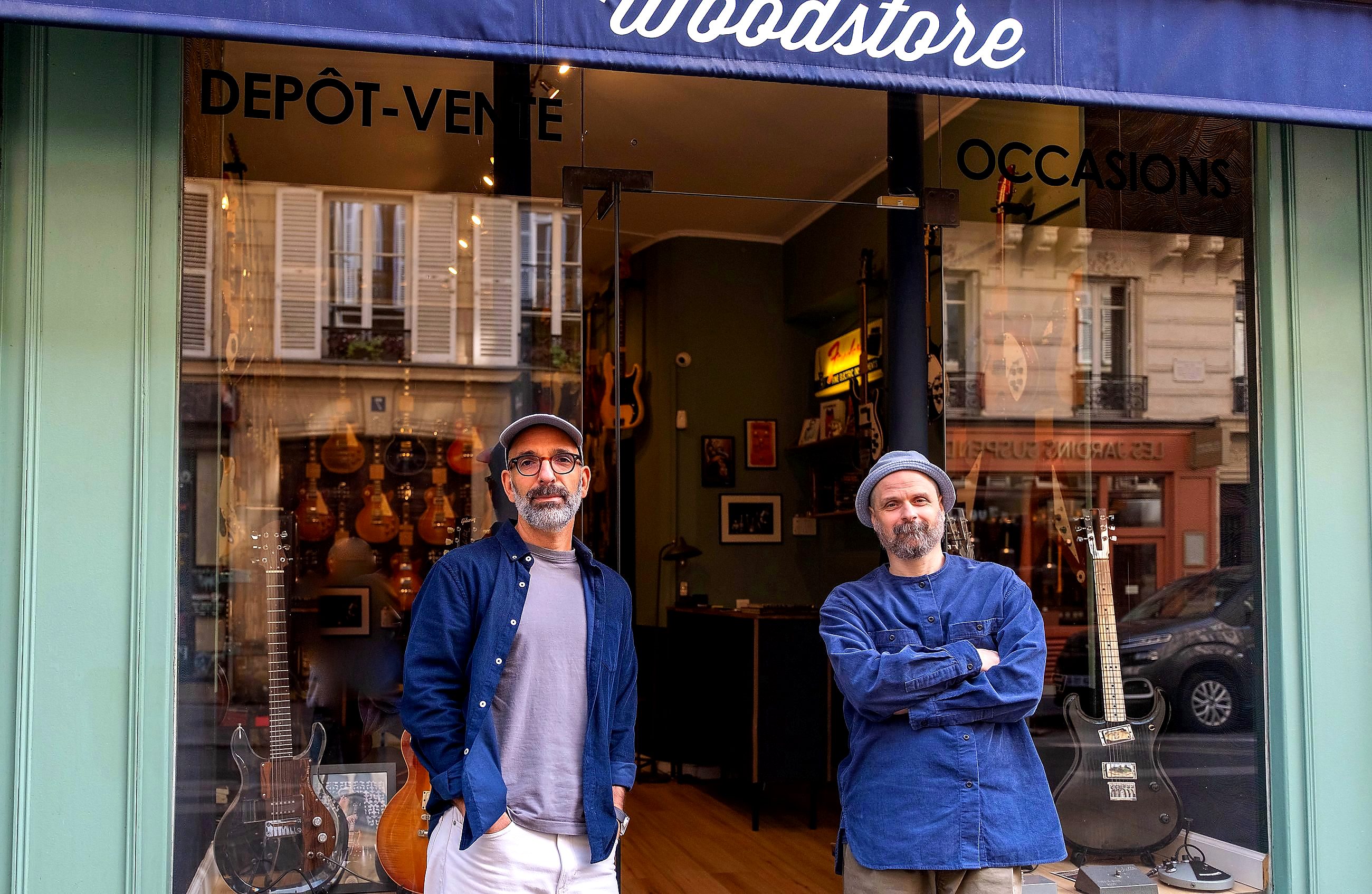 Julien and Vincent outside the shop